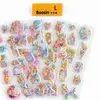 Transparent pastel acrylic-style sticker samples with holographic star inclusions