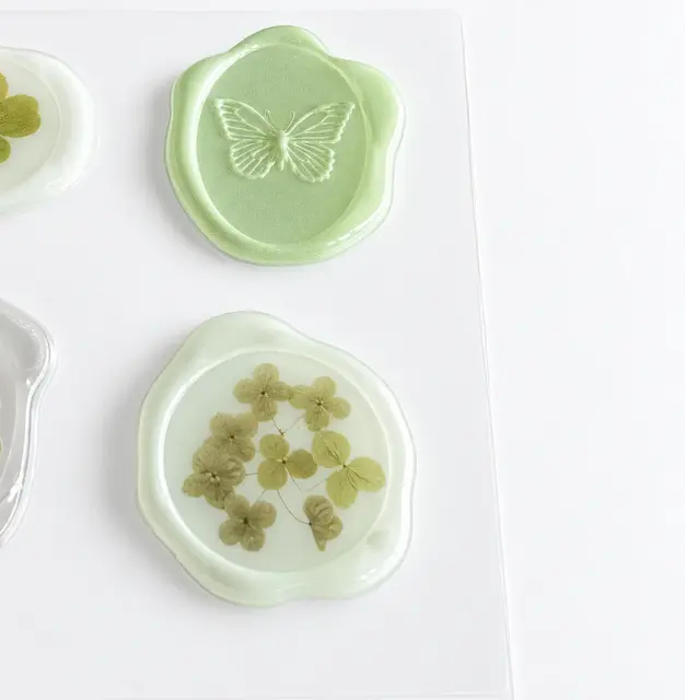 Embossed butterfly and floral seal-style decorative sticker samples