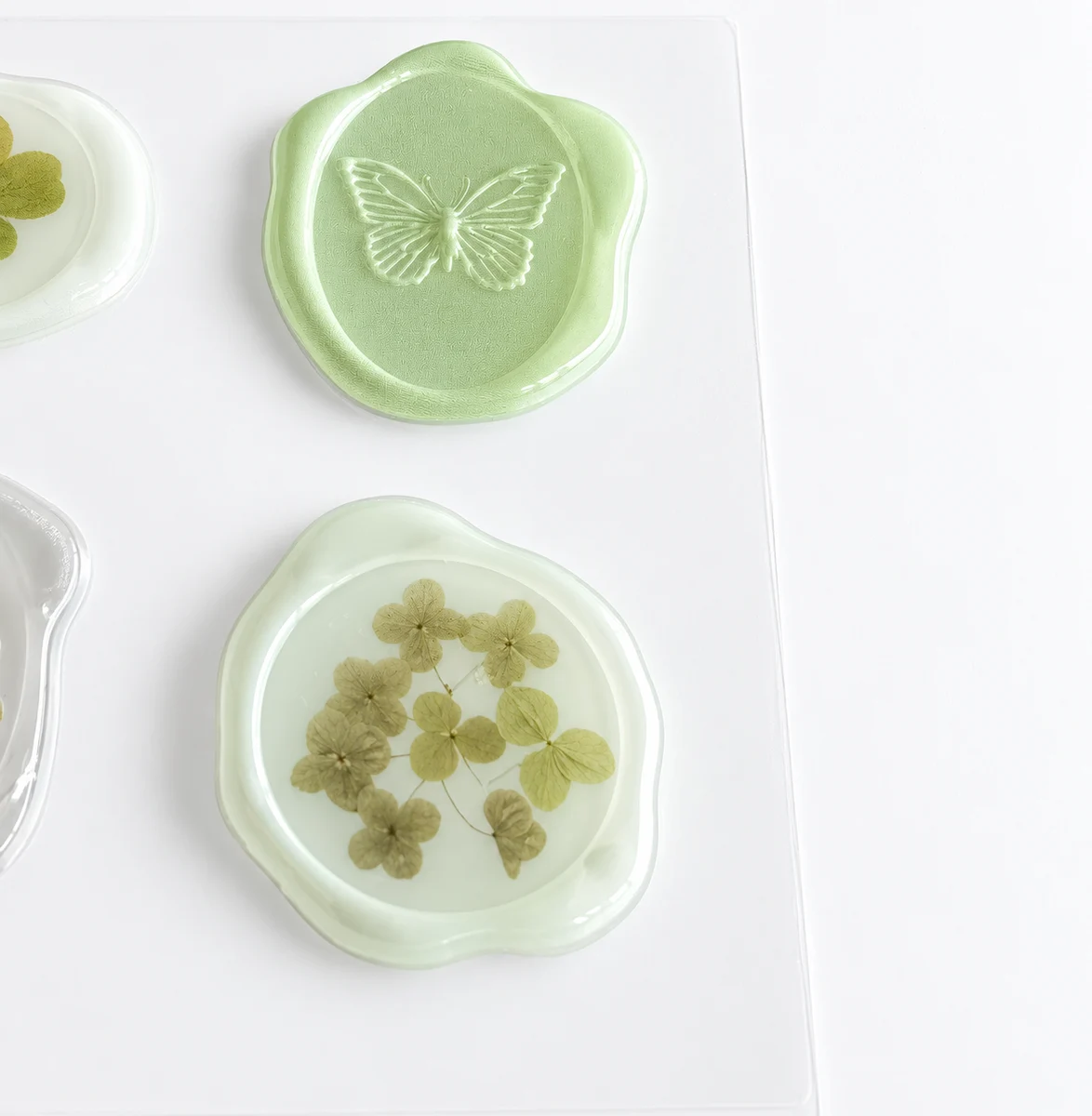 Embossed butterfly and floral seal-style decorative sticker samples
